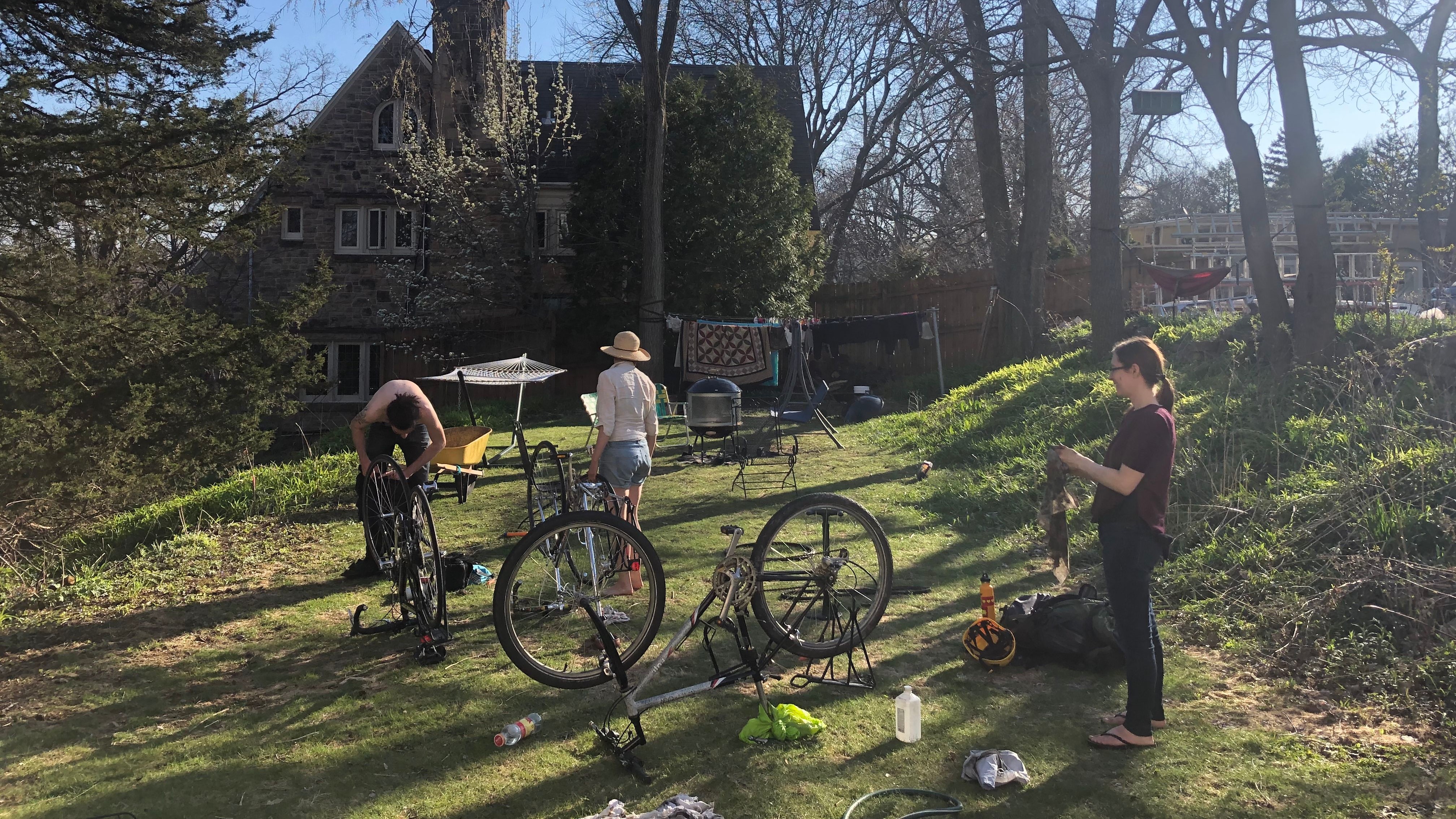 Summiteers tune-up bikes on the front lawn. (Circa summer 2020)